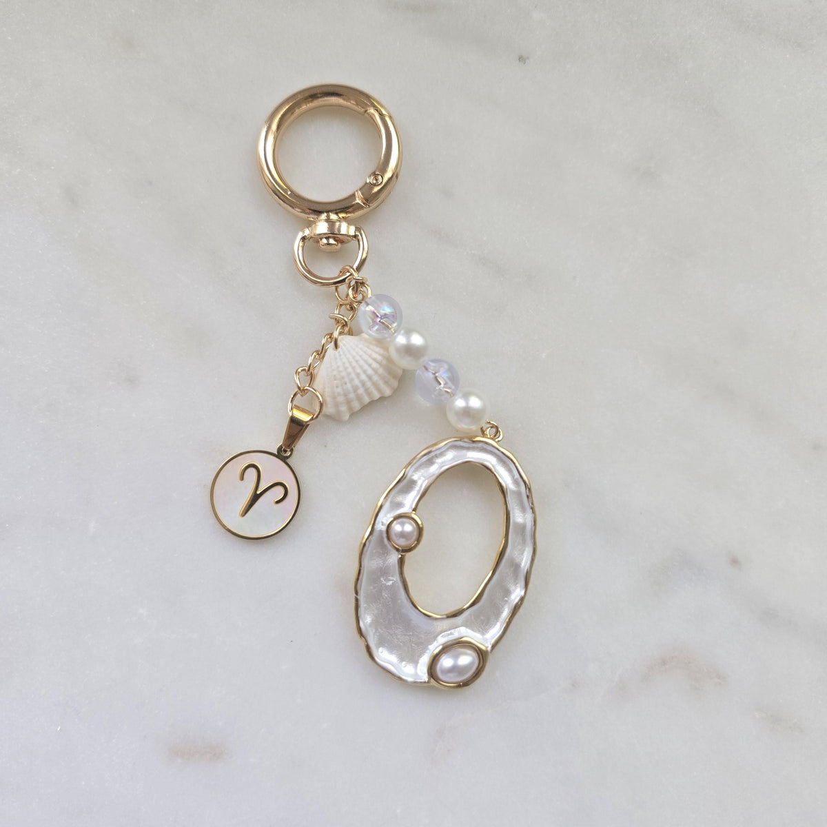 Bag charm with Ocean vibes | one of a kind elegant gold seashell with zodiac sign charm