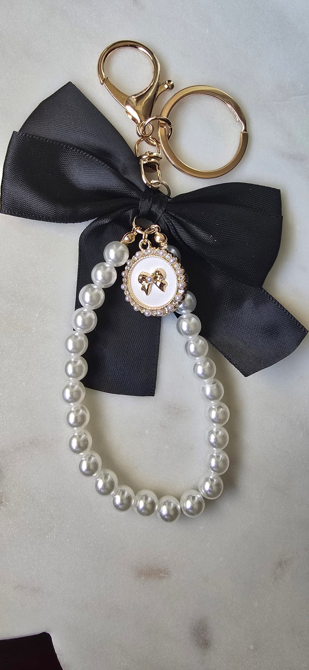 Black Satin Bow Bag Charm Pearl Wristlet Keychain, product photo 2 from Rey & Luck Co
