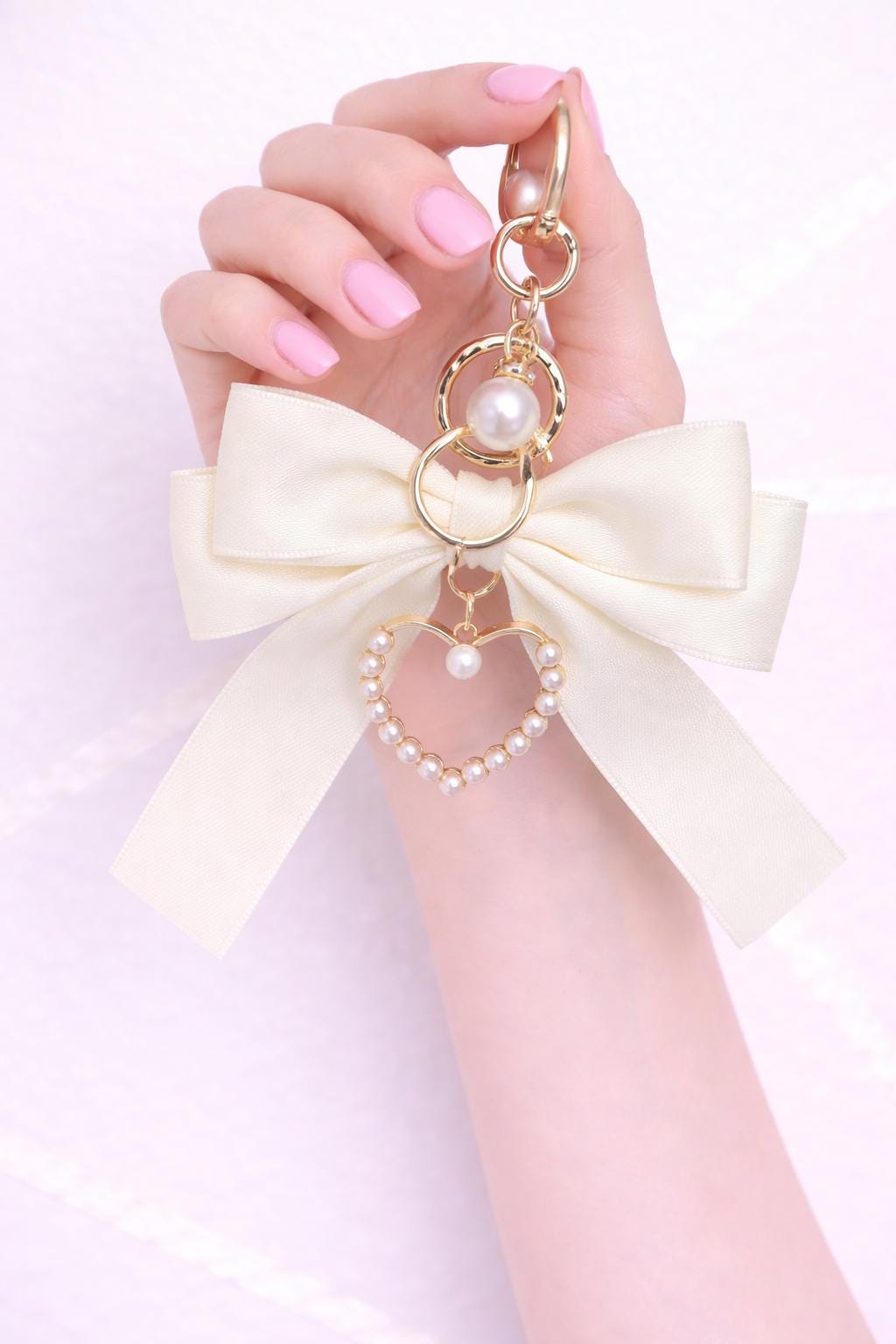 Pearl Heart Bow Bag Charm Coquette product photo from Rey & Luck Co