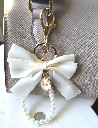 Cream Silky Ribbon Bow Bag Charm Pearl Wristlet product photo 2 from Rey & Luck Co