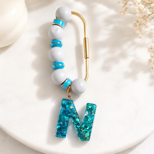 Personalized Letter Bag charm with blue glitter and beaded product photo from Rey & Luck Co